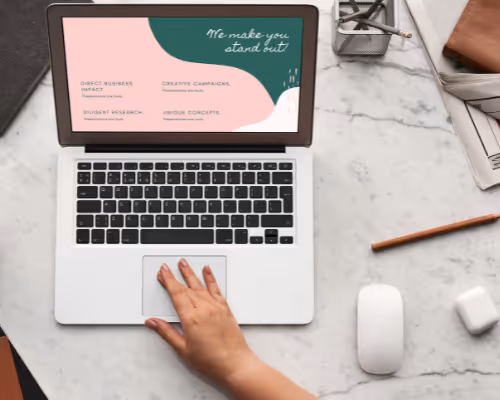 Person using laptop with marketing campaign display