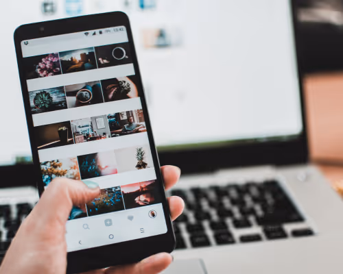 Person browsing photo gallery on smartphone