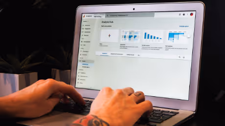 Person analyzing website data on laptop screen