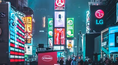 Bright neon advertisements in a bustling city at night