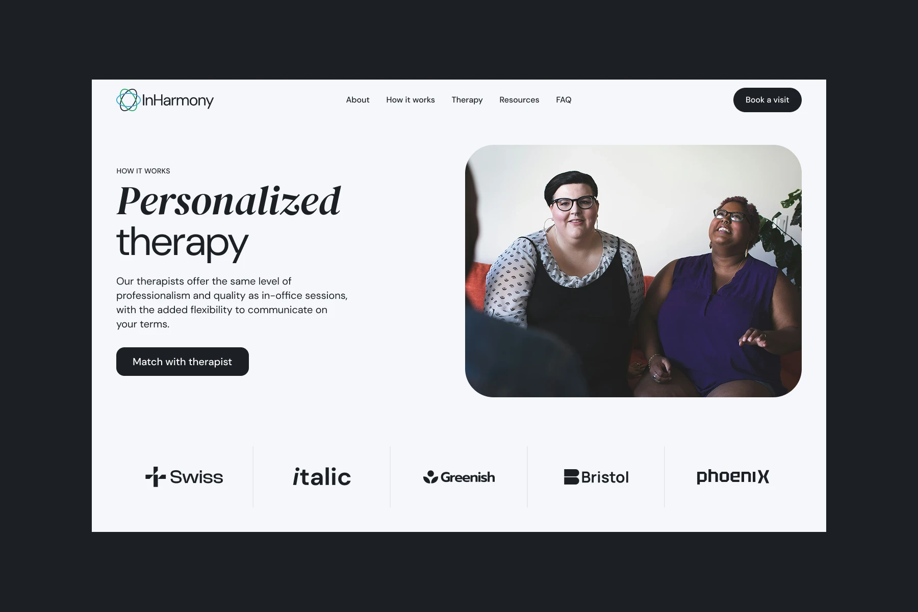 Two women sitting on a couch engaged in a therapy session with a third person.