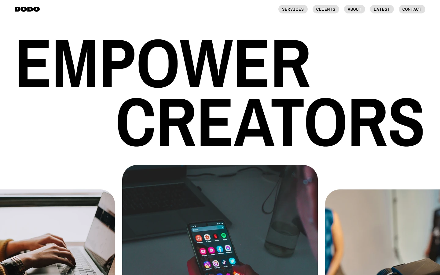 Website header with bold text 'EMPOWER CREATORS,' BODO logo, navigation menu, and images showing hands typing on laptop, a smartphone with apps, and a person with a camera.