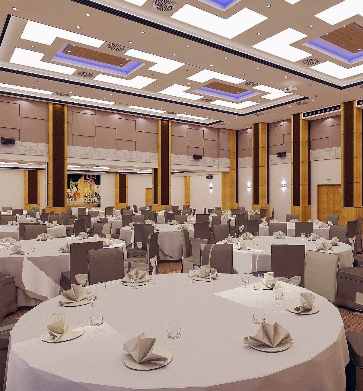 Spacious banquet hall with round tables set with white tablecloths, folded napkins, glassware, and surrounded by grey chairs.