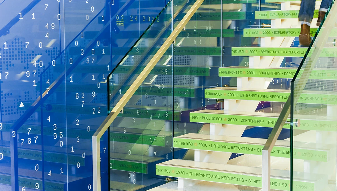 image of handshake over a financial report