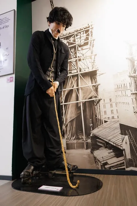 Charlie Chaplin wax figure as the Tramp with cane and bowler hat at WAX Museum of Legends Colmar