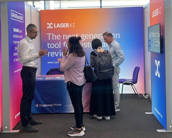 The Laser AI stand and team at the Cochrane Colloquium 2023