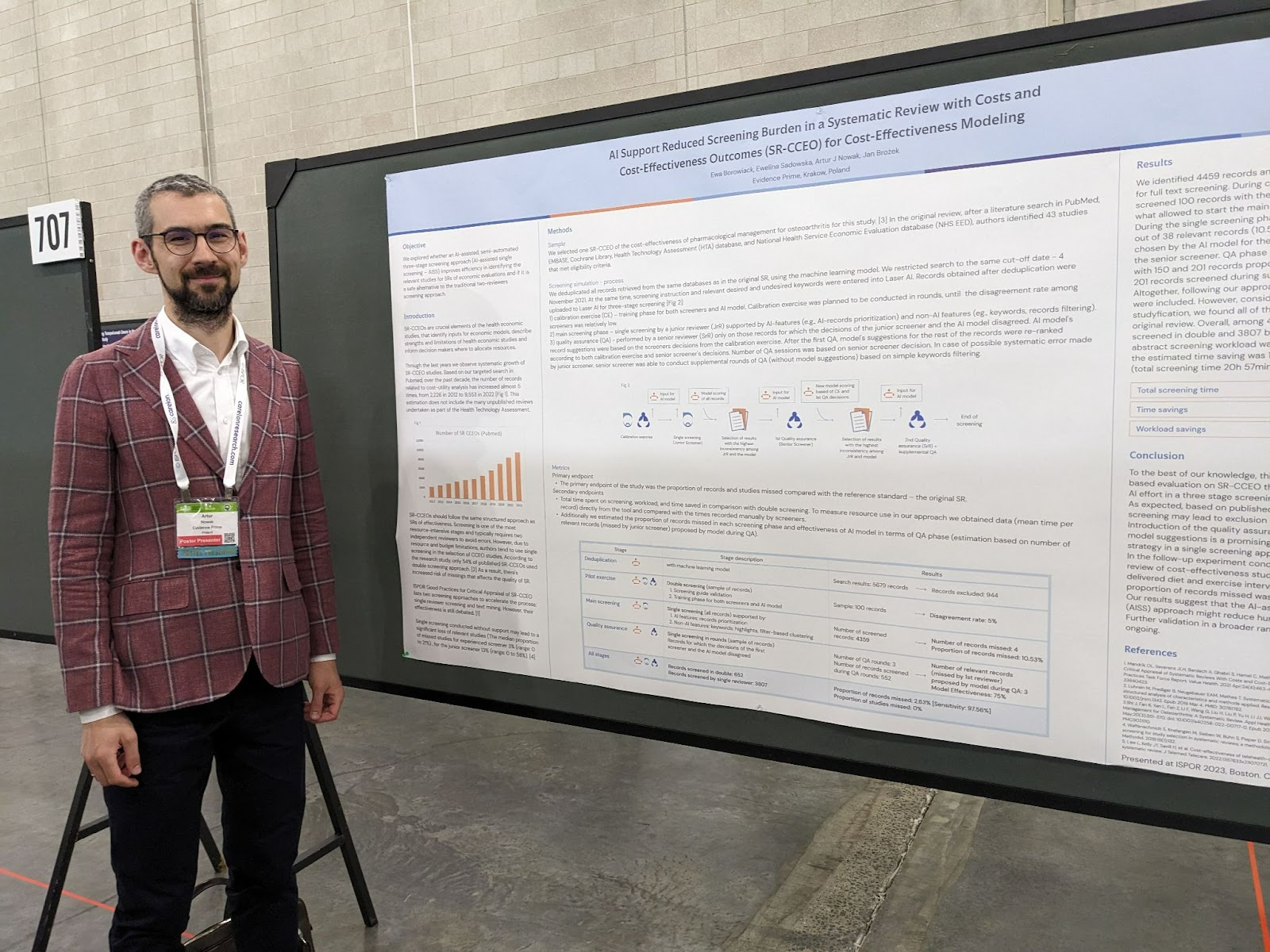 Artur Nowak, a founder of Laser AI standing beside a poster on AI- assisted single screening