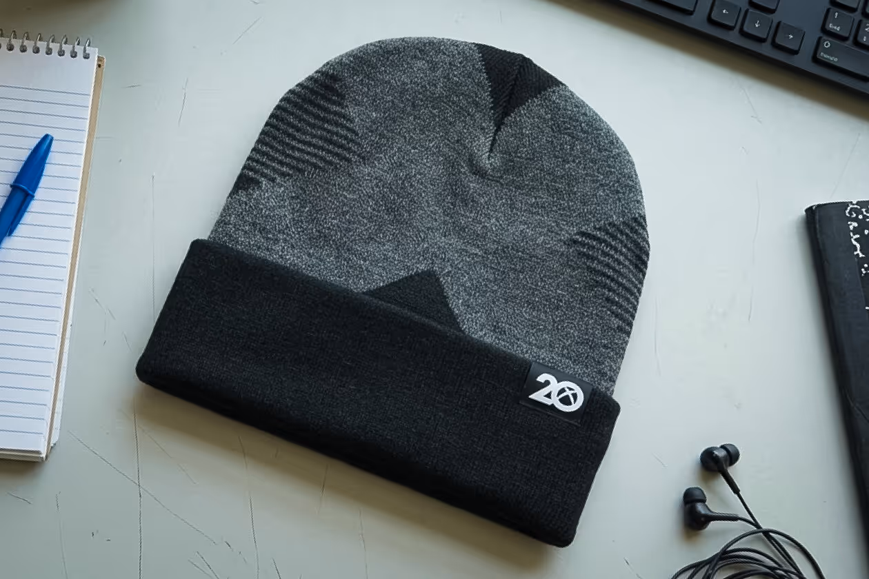 A picture of a custom xbox hat on a desk. 