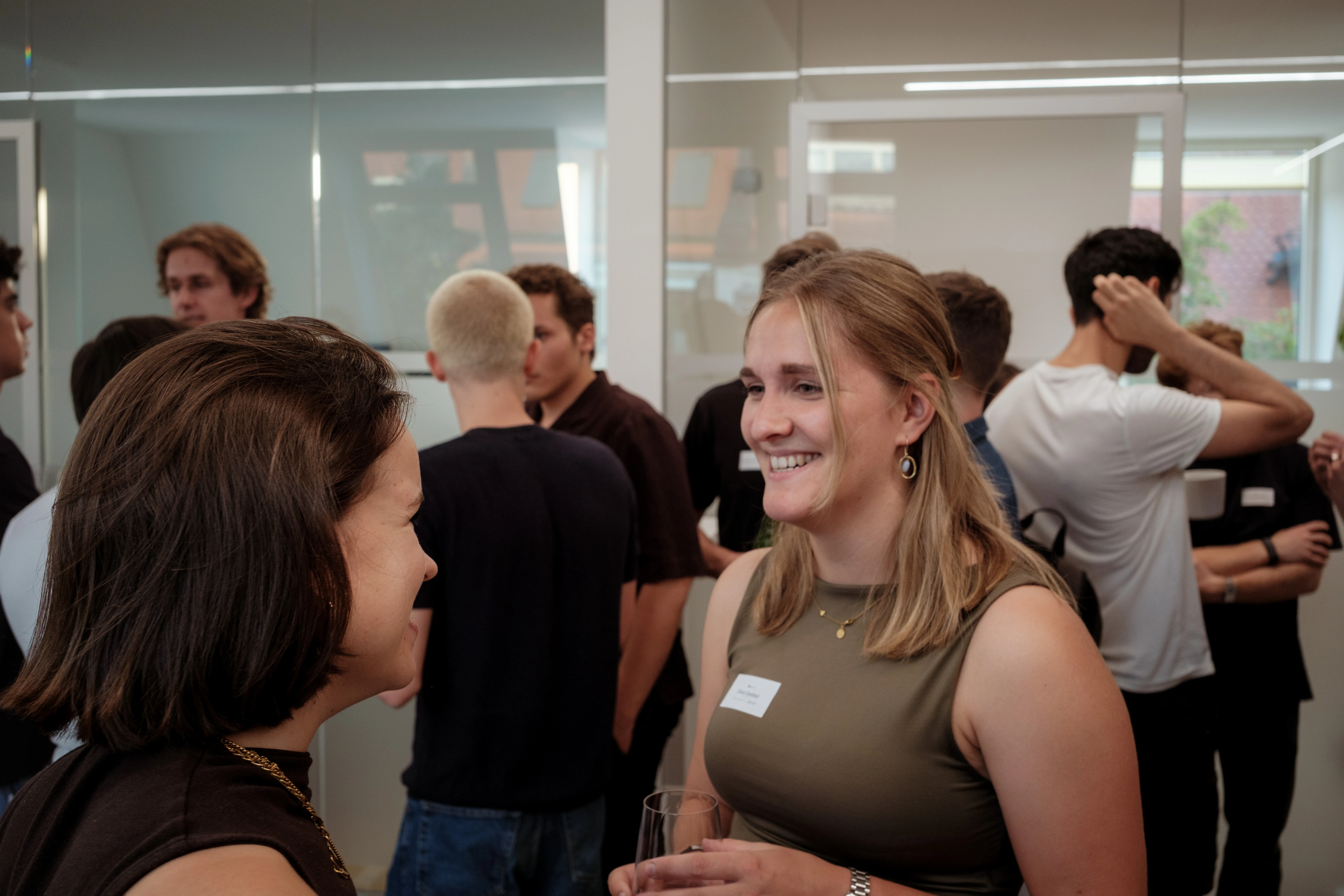 Guest smiling at an office mixer