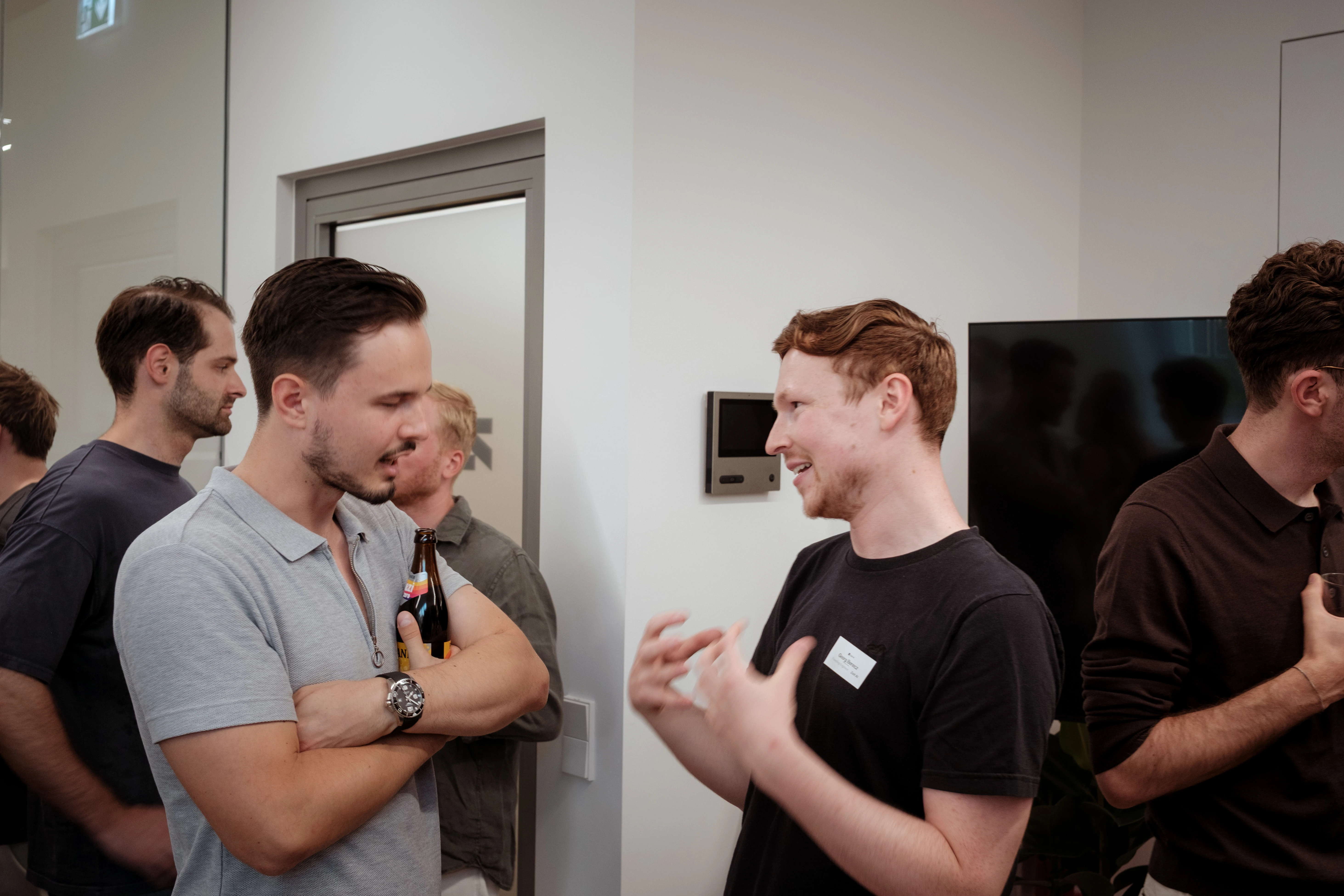 Colleagues chatting at an office mixer