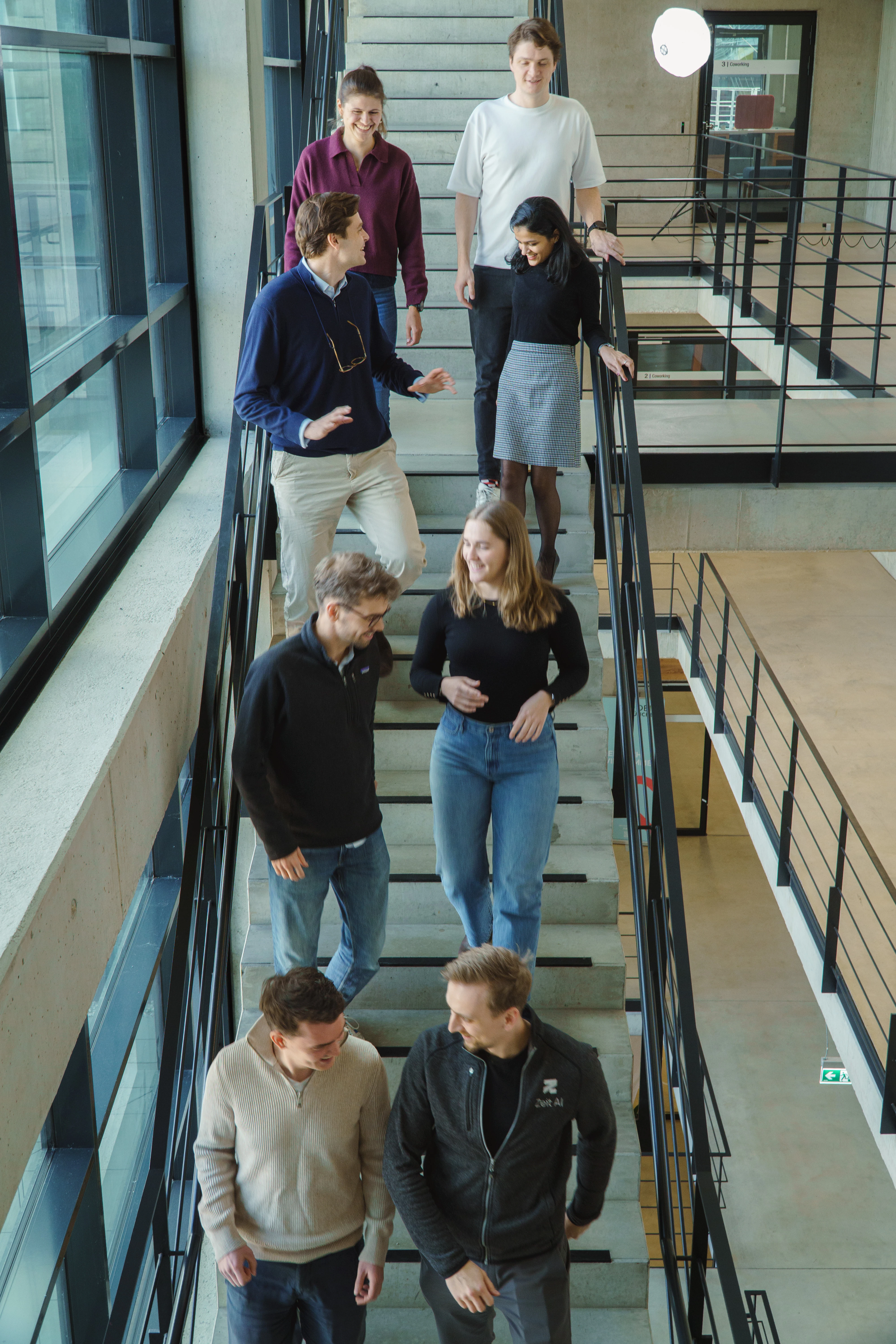 Zeit AI team photo on the office staircase