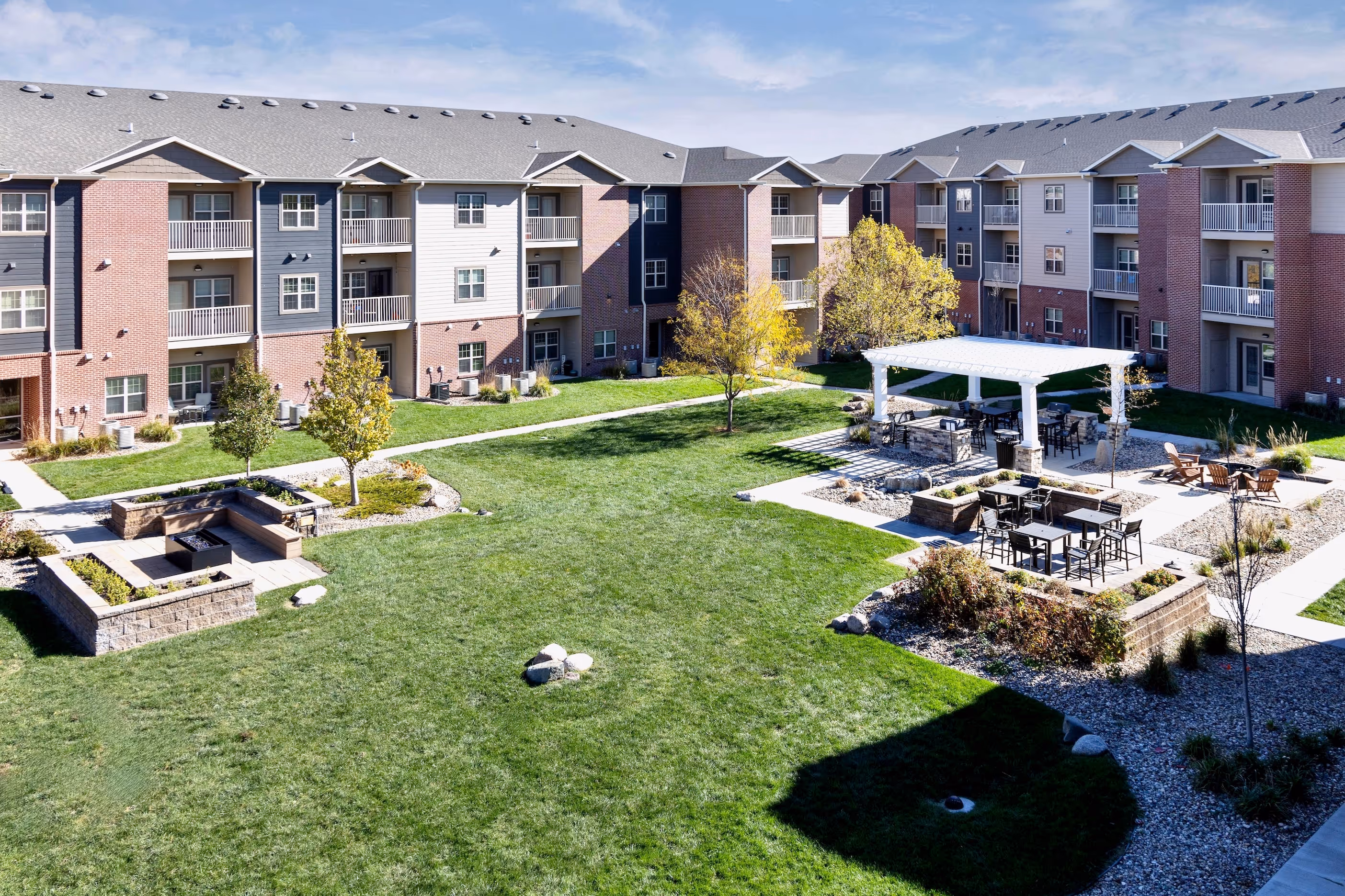 Courtyard with outdoor seating and exterior of apartments