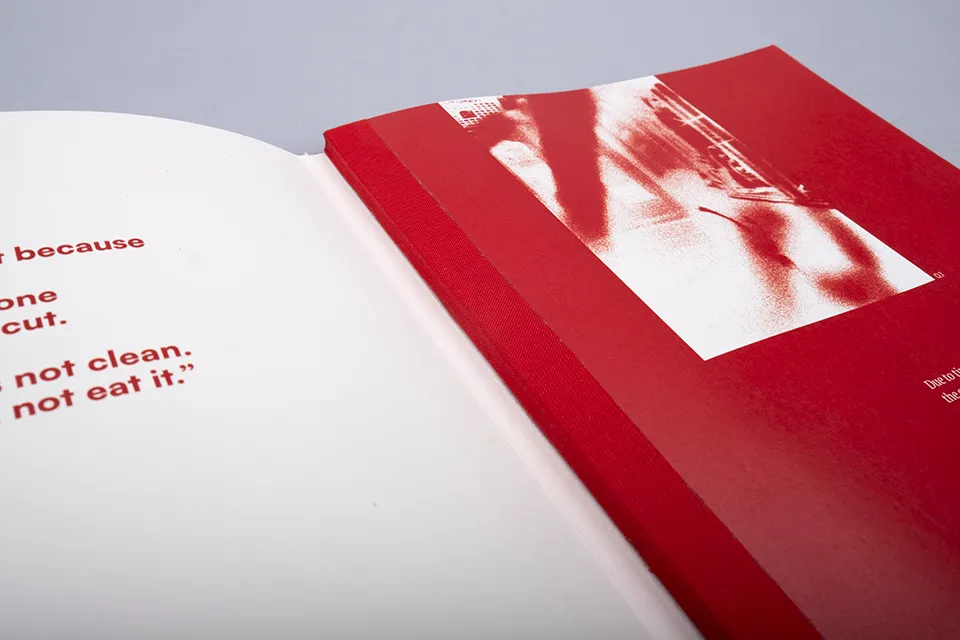 An open magazine about Female Genital Mutilation showing the binding of the magazine.