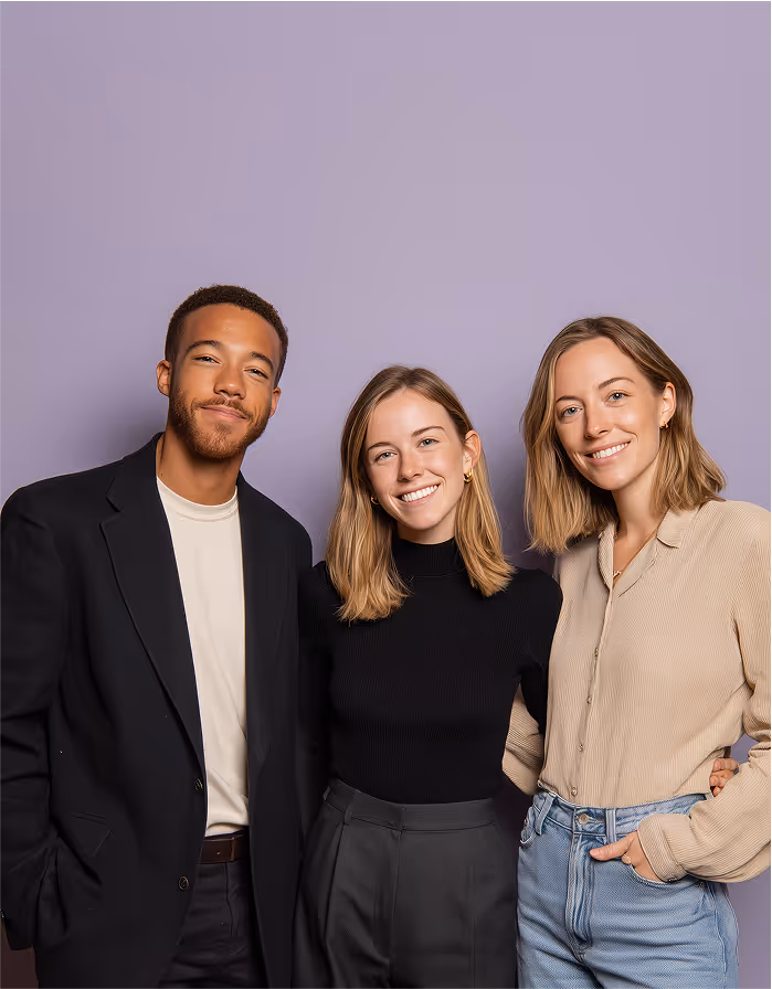 Three formally dressed professionals standing together, representing a reliable and diverse hiring team.