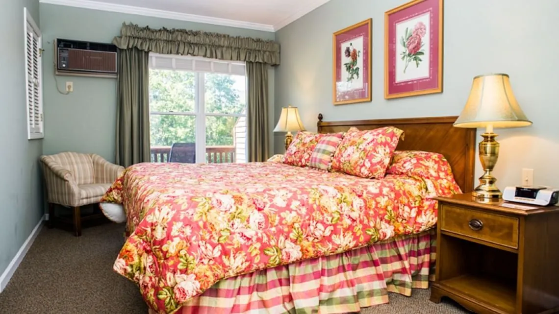 Bedroom with a king bed and balcony view
