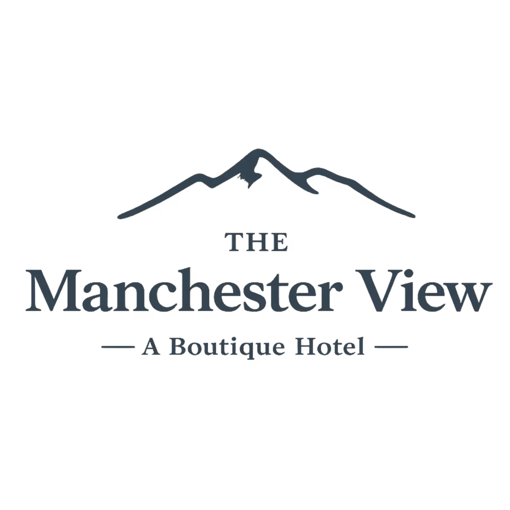 Logo showing a mountain outline above the text The Manchester View, A Boutique Hotel.