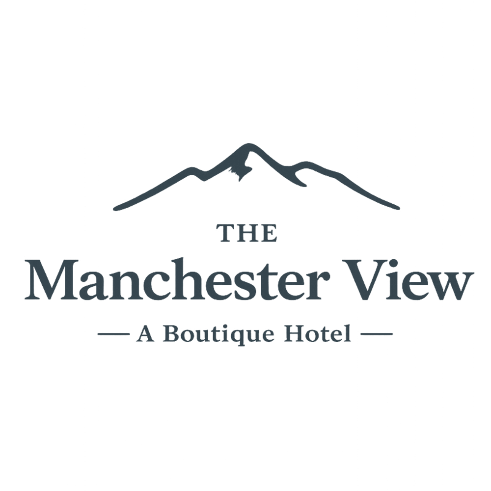 Logo showing a mountain outline above the text The Manchester View, A Boutique Hotel.