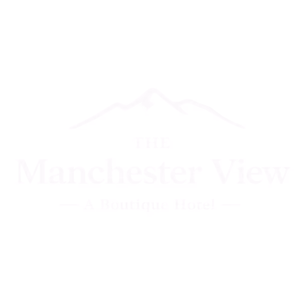 Logo of The Manchester View boutique hotel with mountain outline above text.