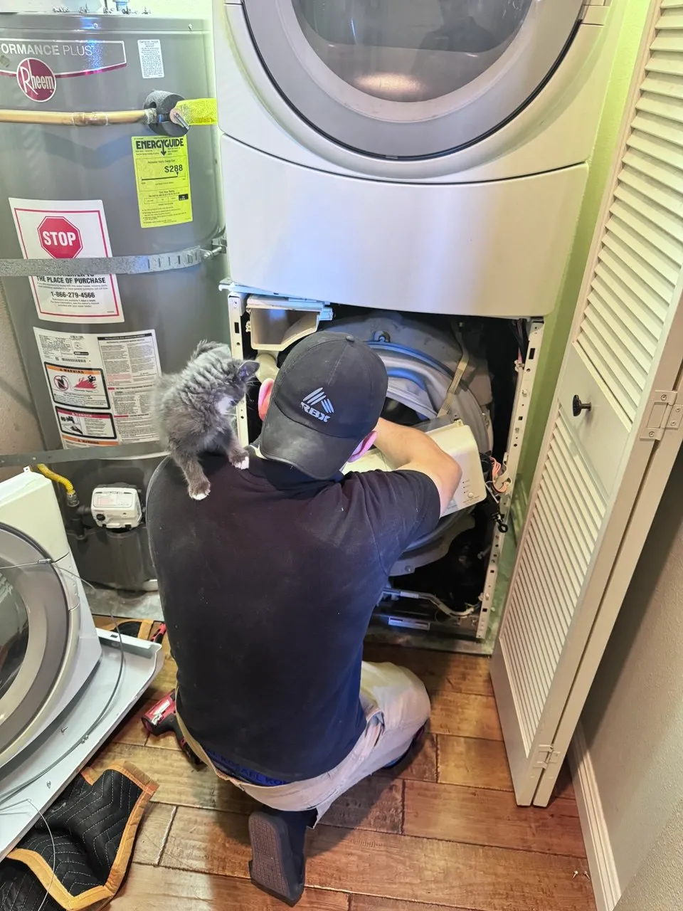 Technician repairing a washer