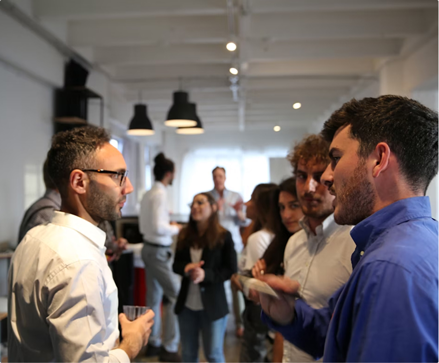 Two men talking at a conference.