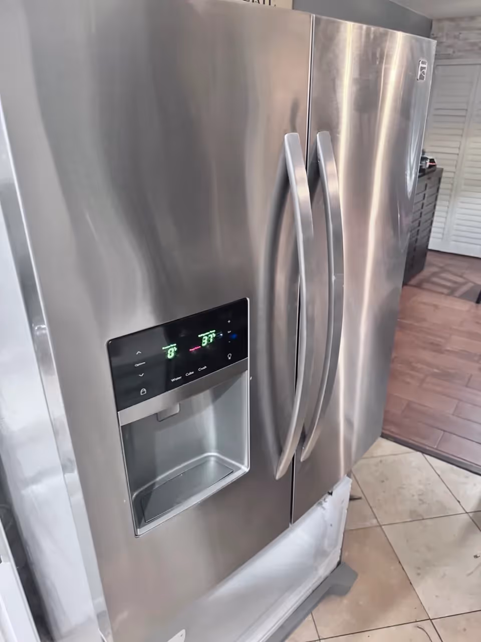 Stainless steel Kenmore side-by-side refrigerator