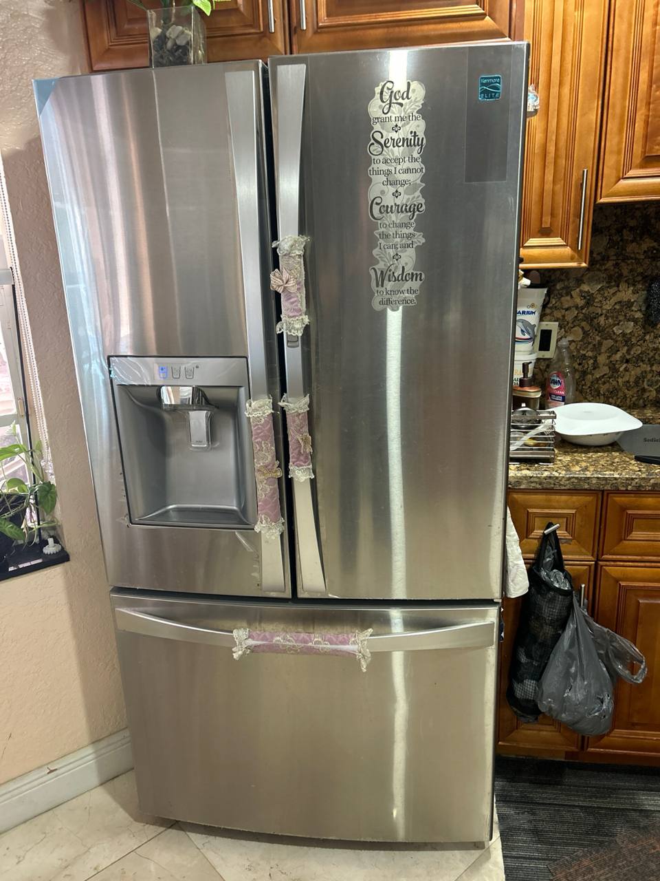Refrigerator standing in residential kitchen