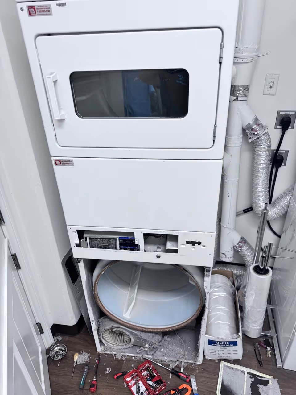 Dryer repair in Huntersville NC with unit opened for heating element inspection