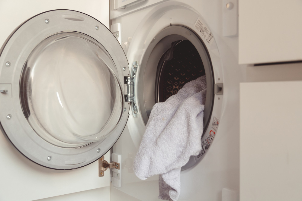 Speed Queen dryer with towel inside drum during residential laundry use
