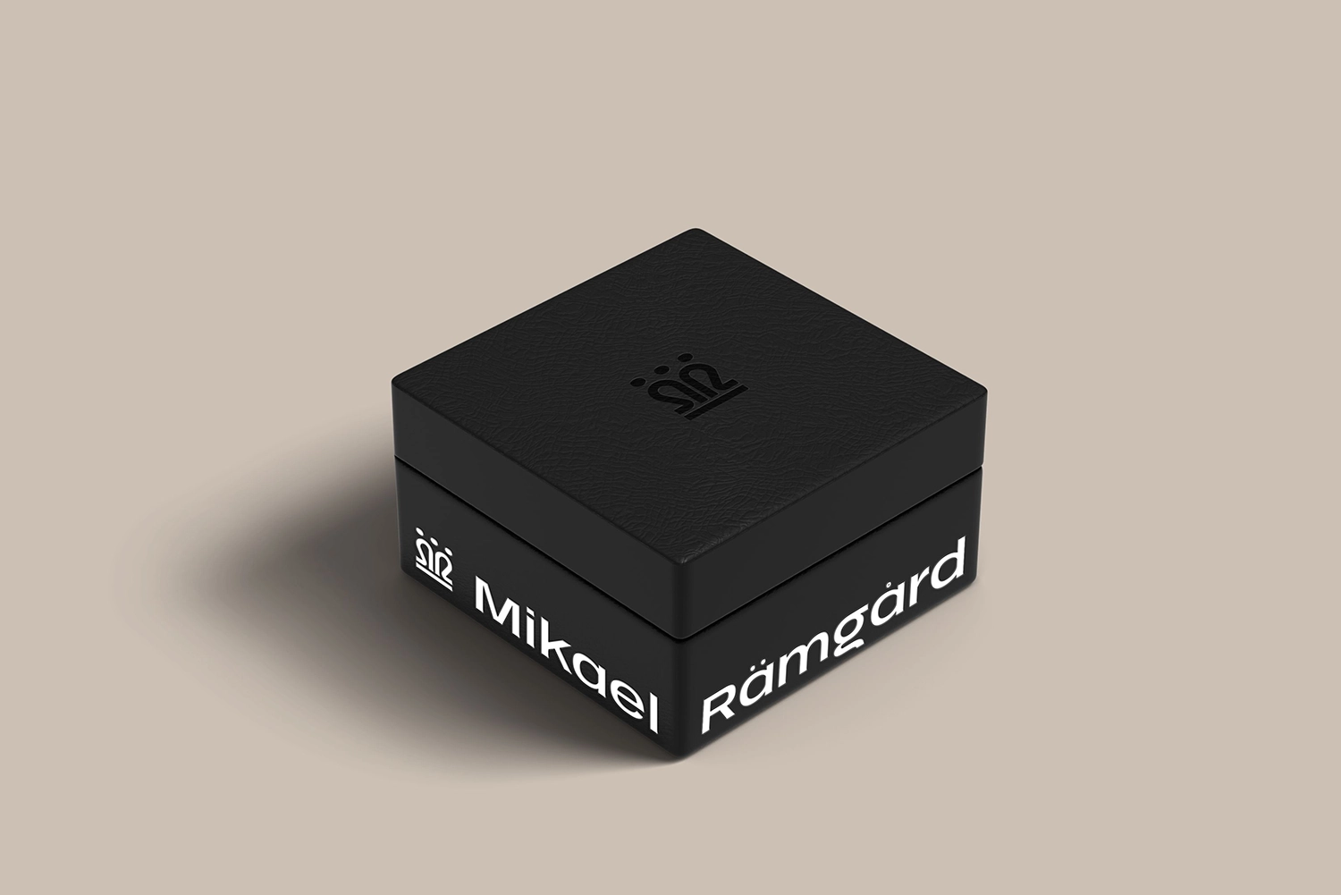 Black jewelry box packaging with Mikael Rämgård name and monogram.
