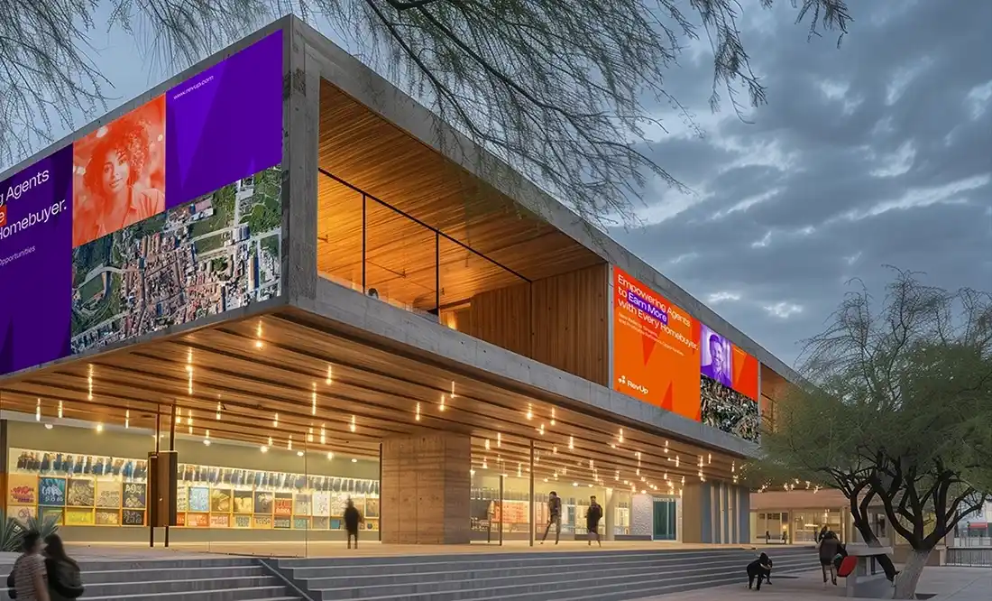 Modern architecture with vibrant digital billboards at dusk.