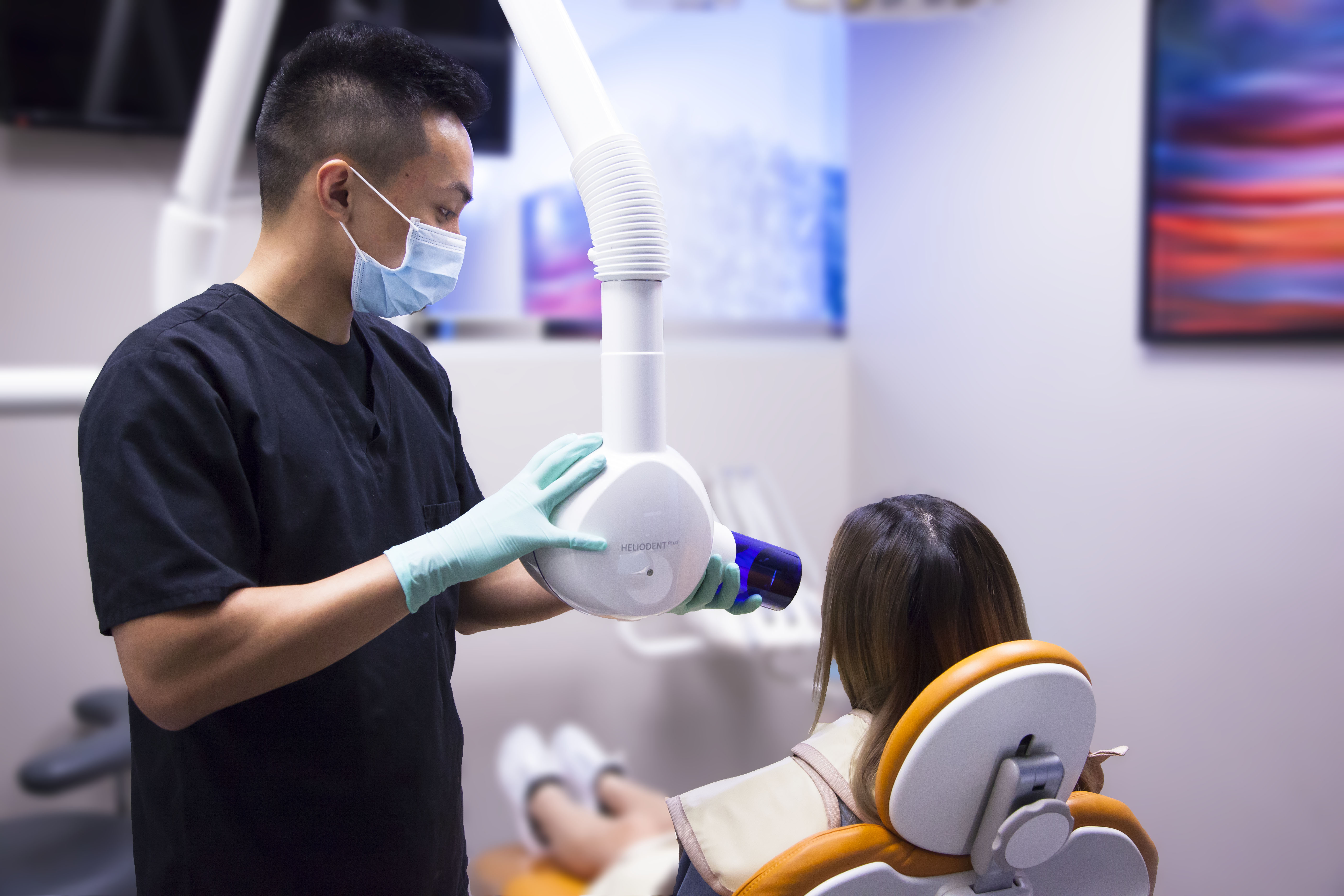 Dental assistant taking x-ray of patient in Garden Grove