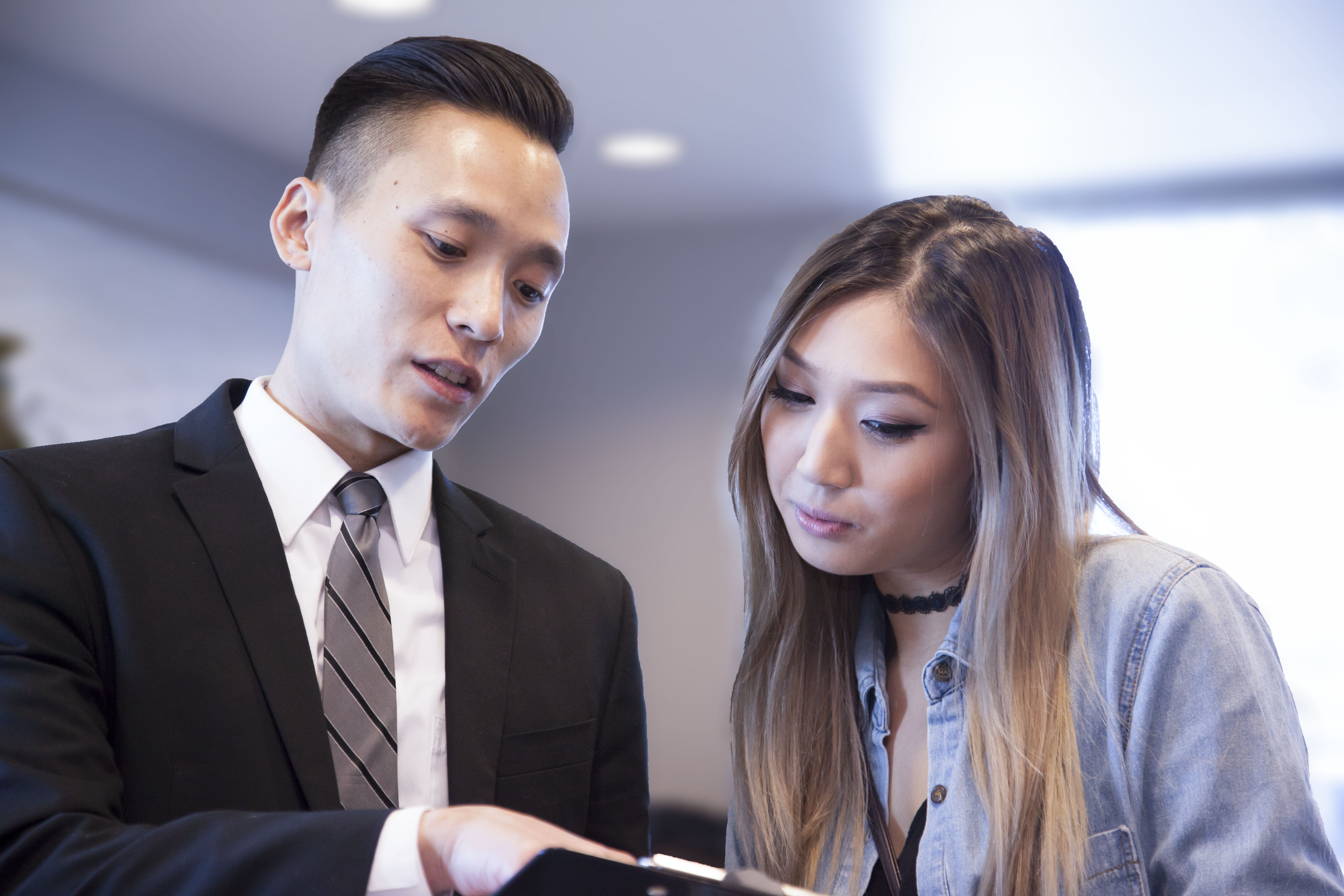 Friendly dental team explaining treatment to patient
