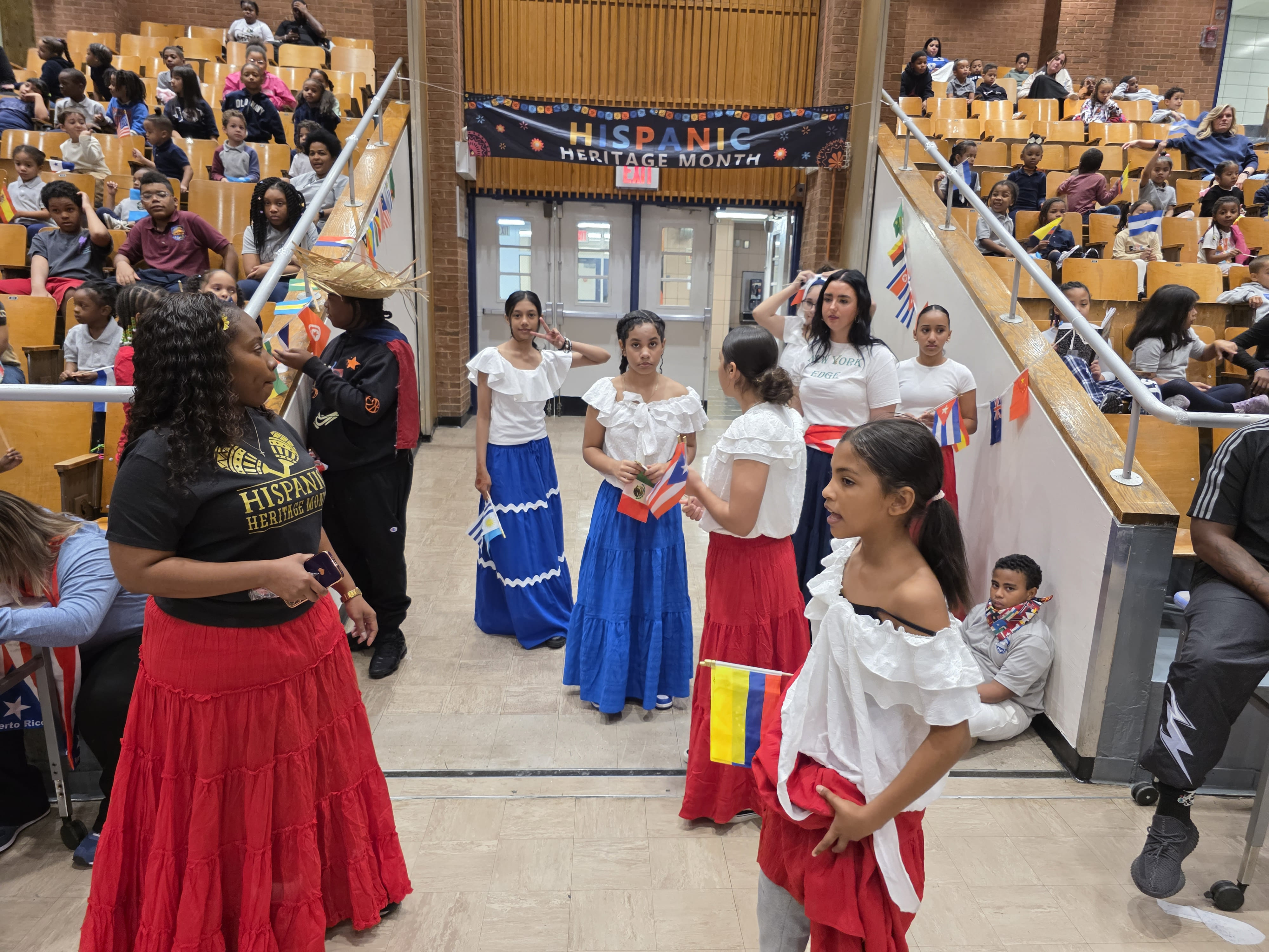Students perform in traditional dress at Hispanic Heritage Month assembly