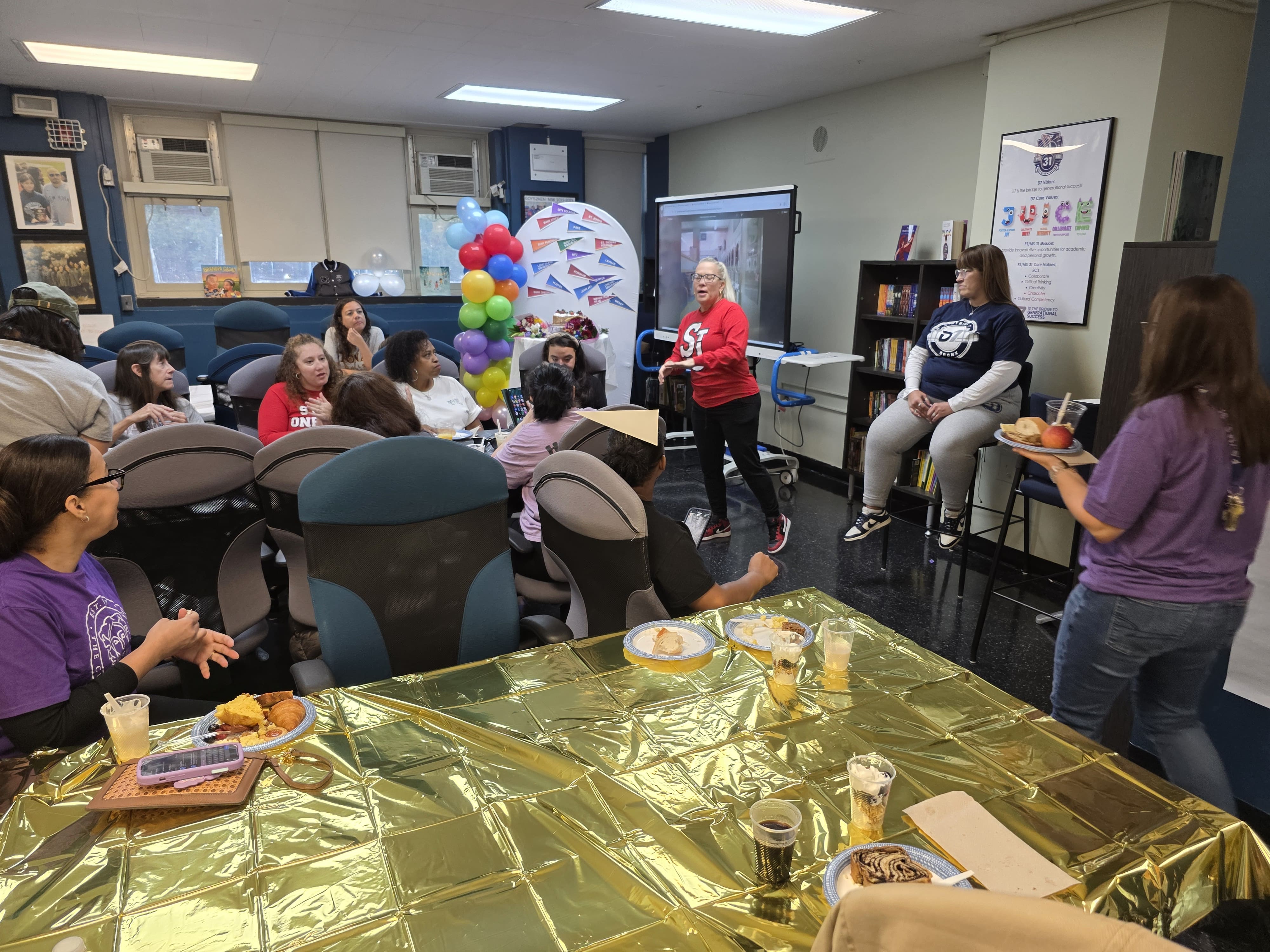 Staff and families gathered at school Fall Fest celebration with food