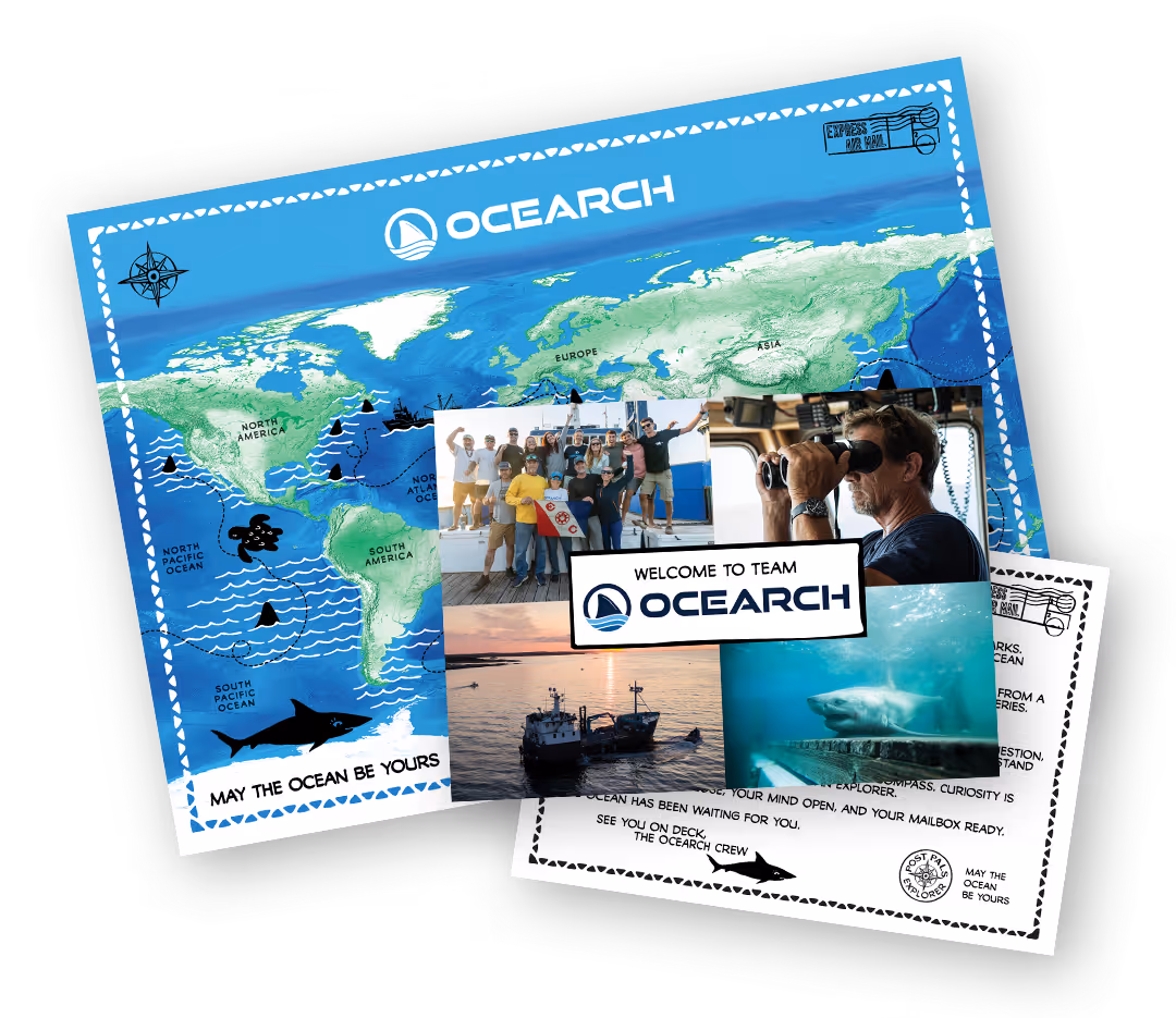 OCEARCH Adventure Kit with a world map and introductory postcard.