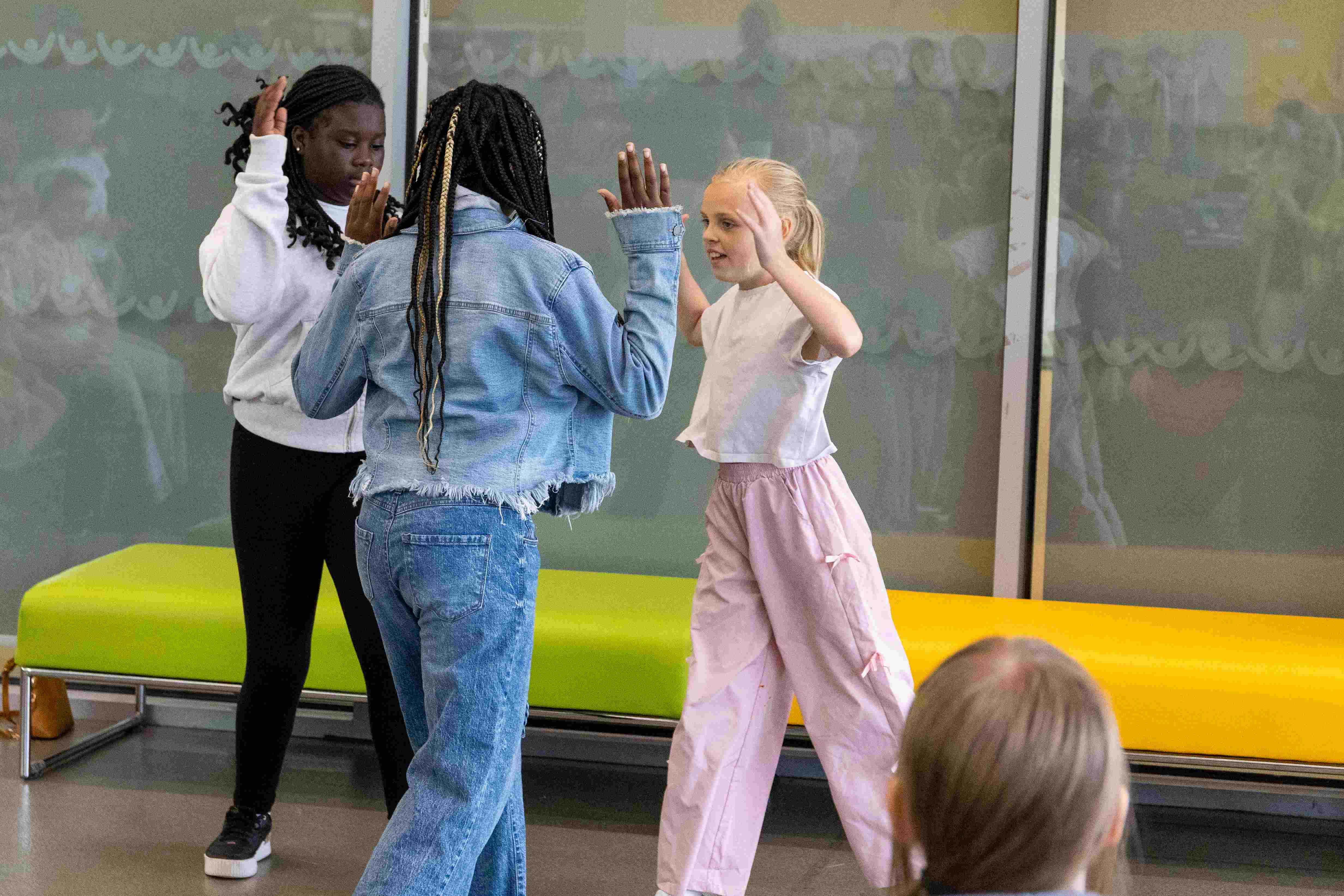 Young People High Fiving