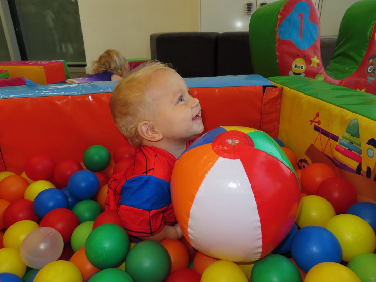 Child playing in ball pit