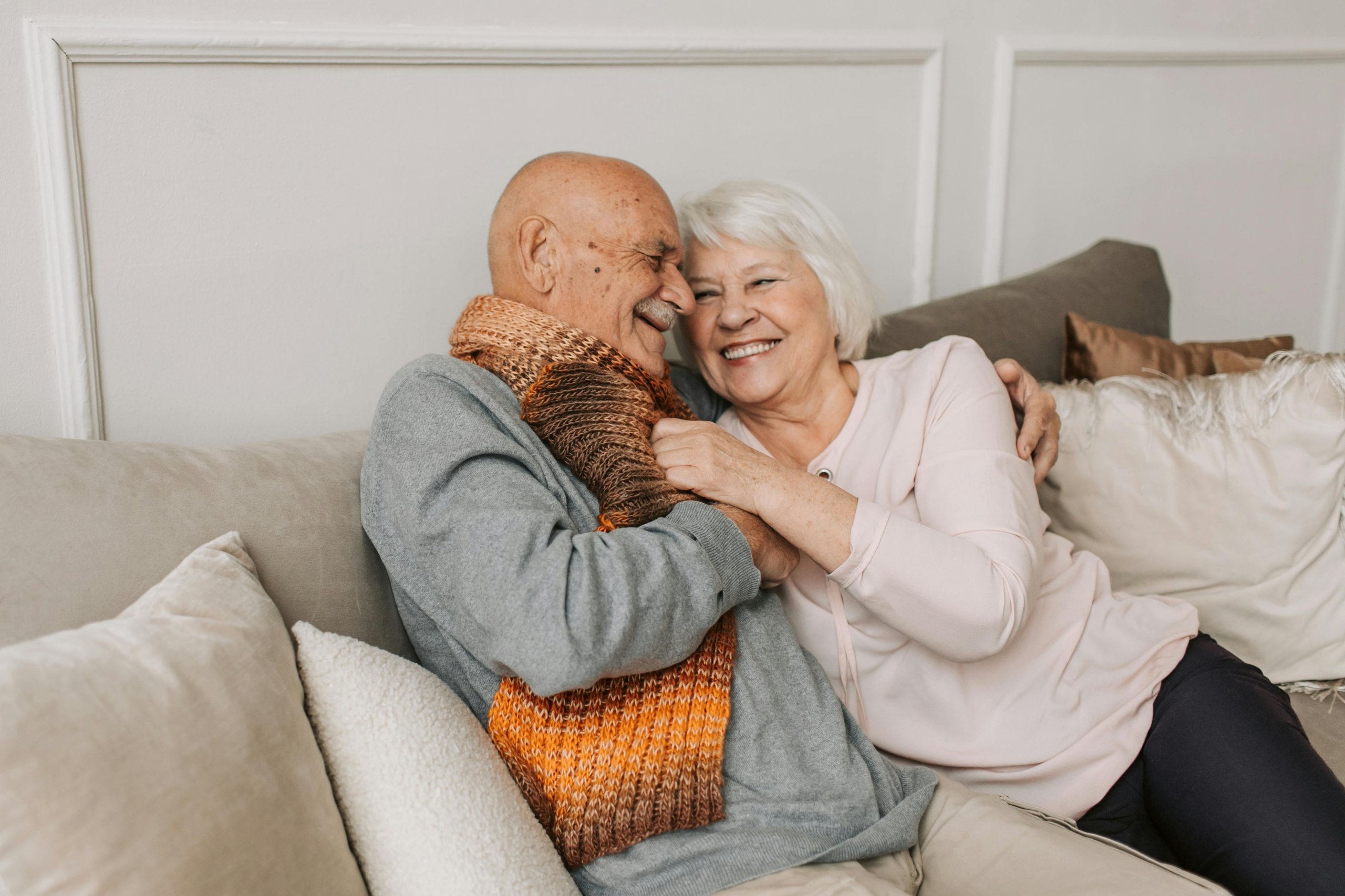 Very happy couple on a couch