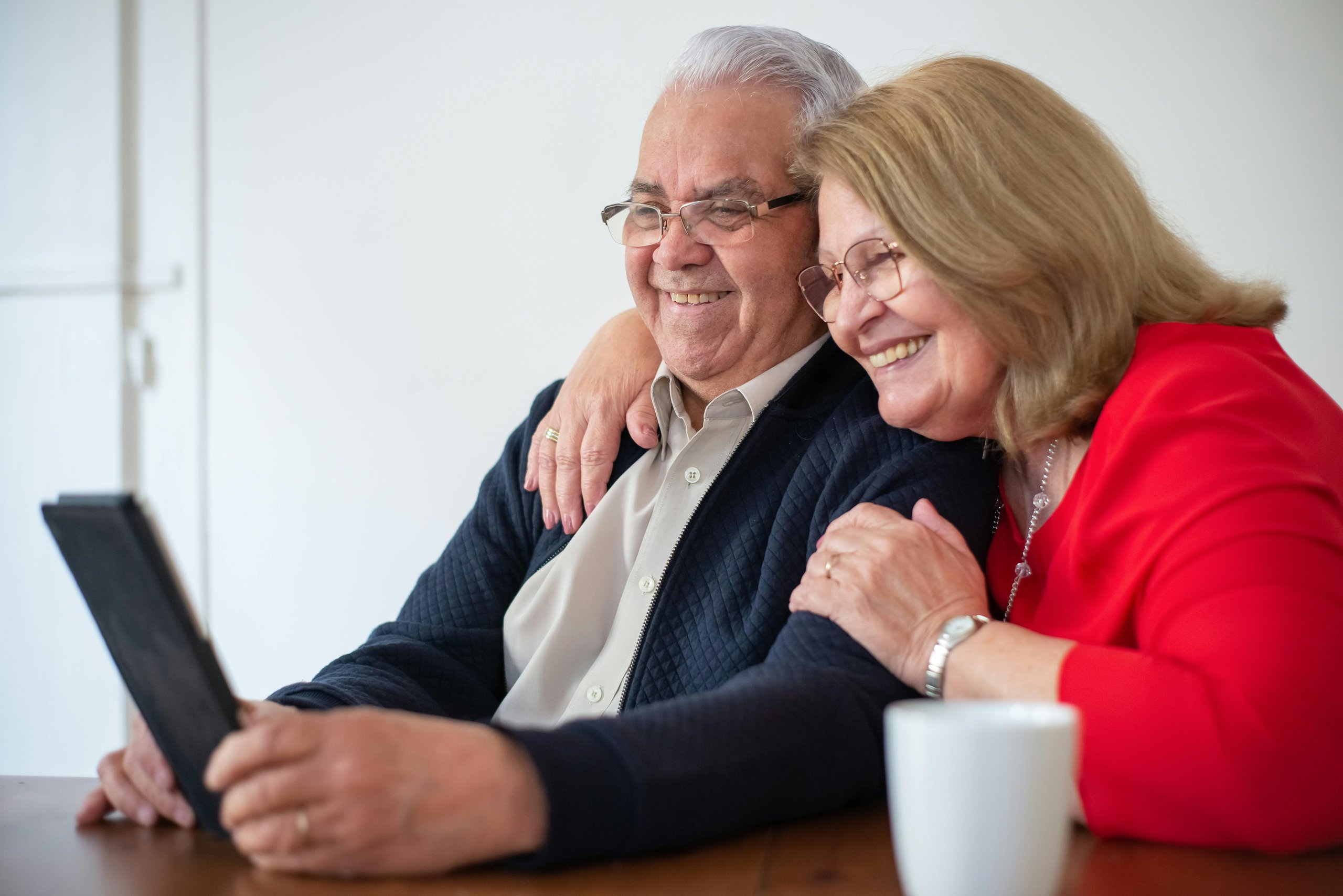 Happy couple looking at a screen