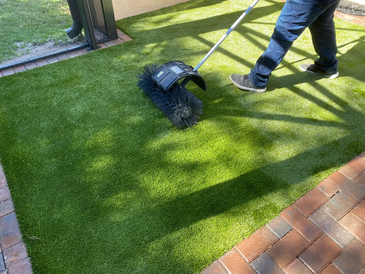 Artificial grass installation for a residential backyard landscape