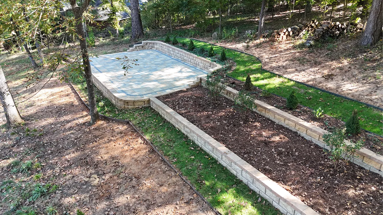Backyard swimming pool installation and landscape construction in progress