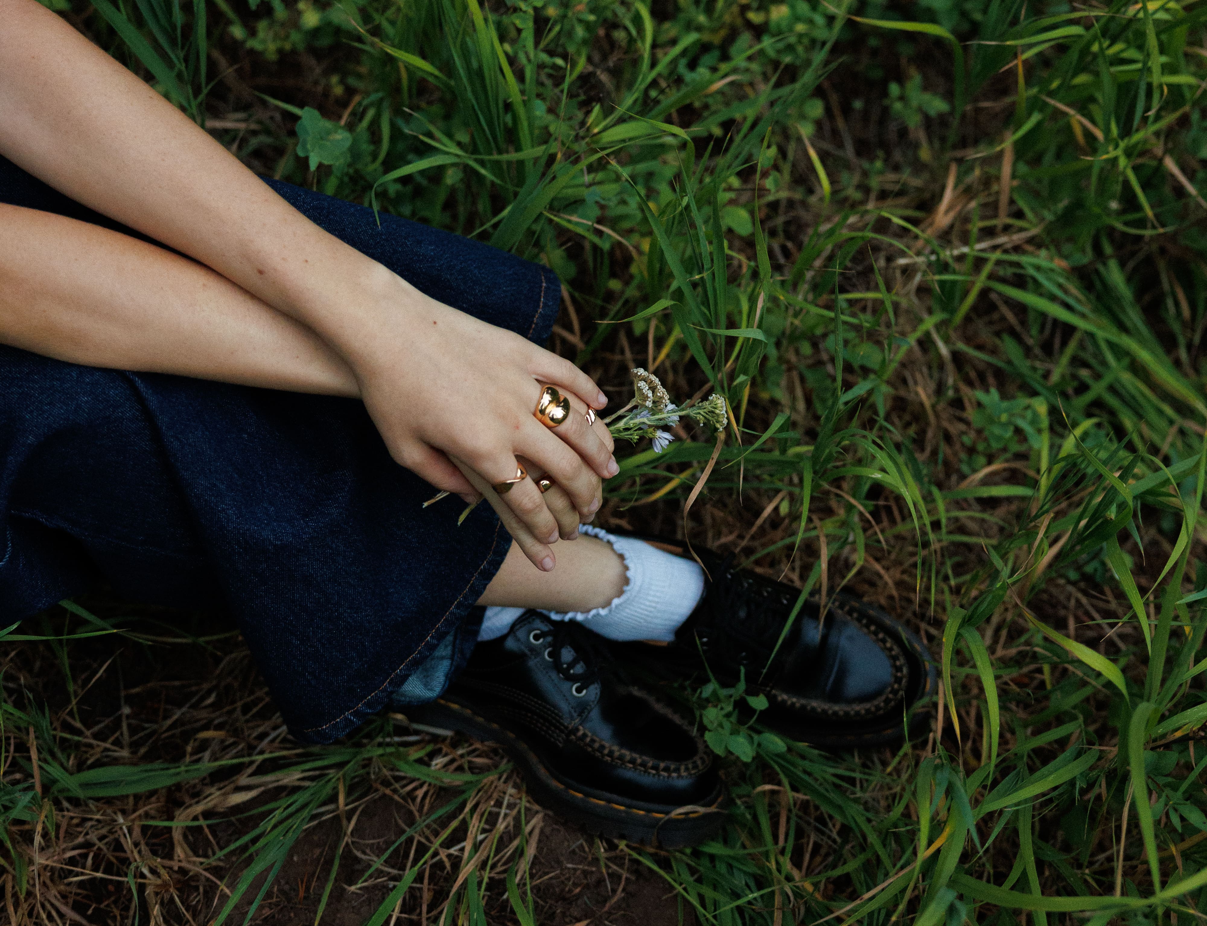 Close up shot of rings and shoes in a field | Wood Films Utah Photography & Videography