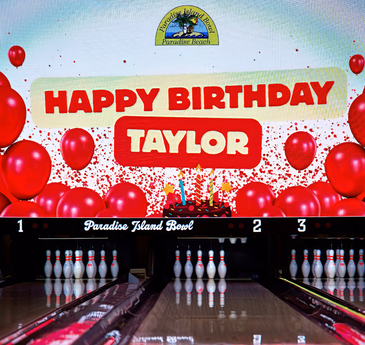 Bowling lanes with pins set up and a birthday message reading 'Happy Birthday Taylor' with red balloons and a birthday cake illustration.