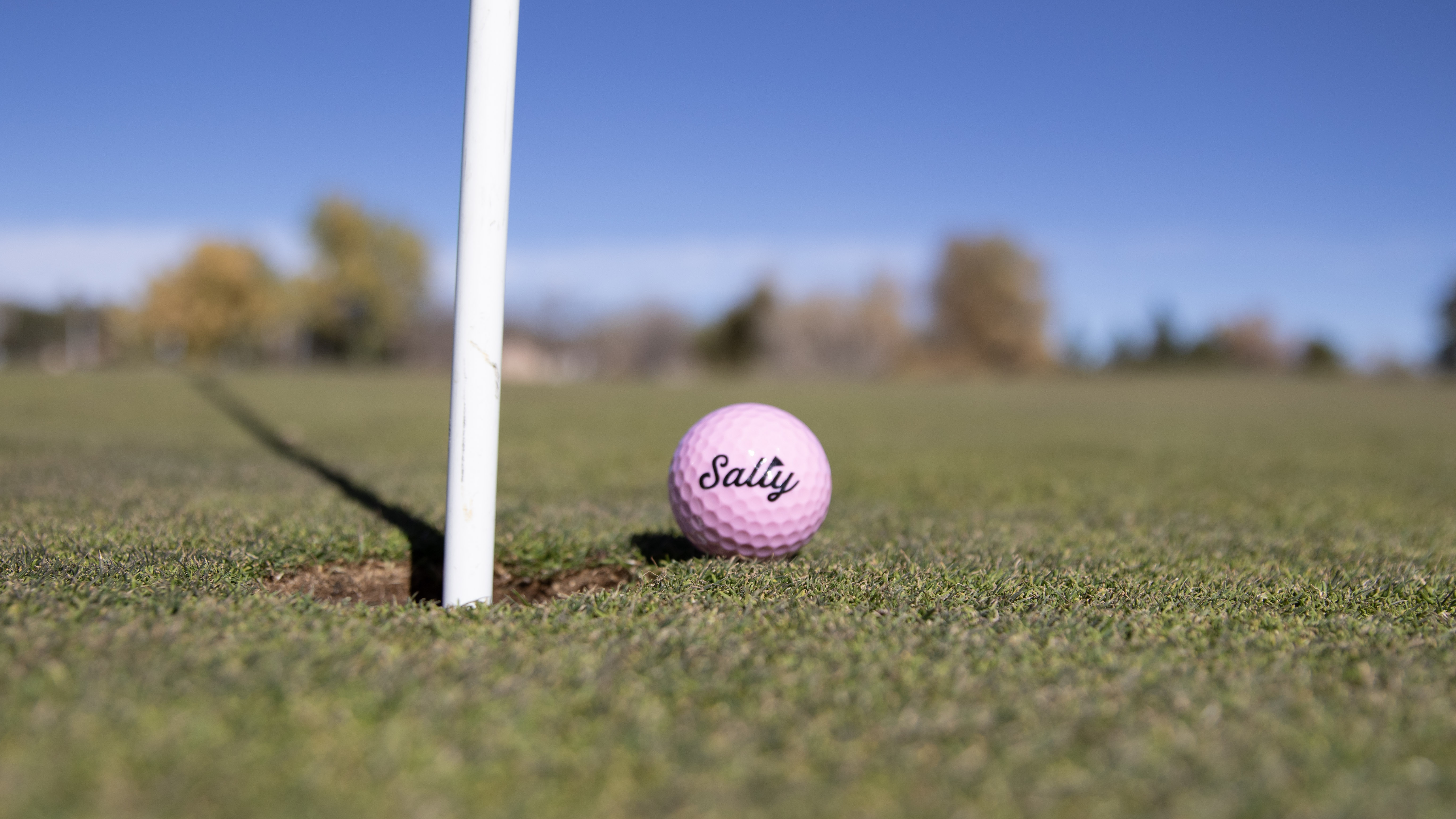 A pink Sally ball stopped just short of the cup