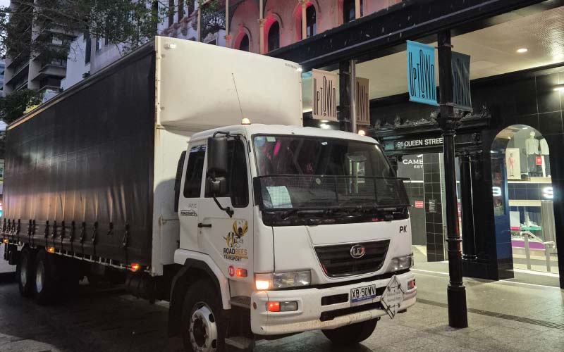 A RoadBees tail-lift truck is parked within metro queen street Brisbane for unload of commercial freight