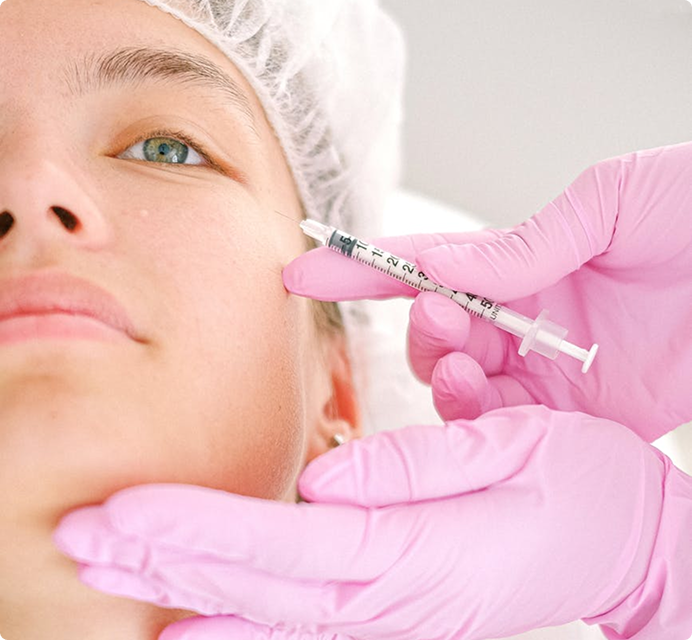 Person receiving cosmetic injection treatment