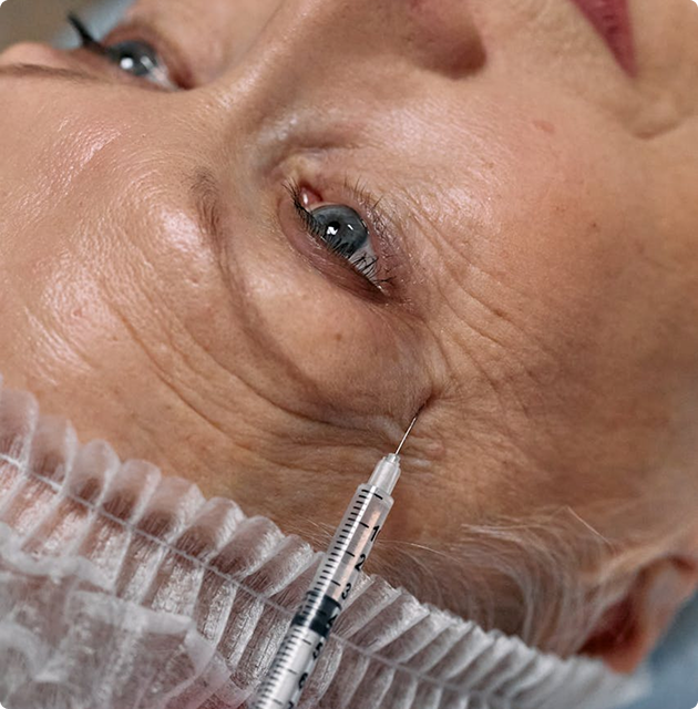 Person receiving cosmetic injection treatment