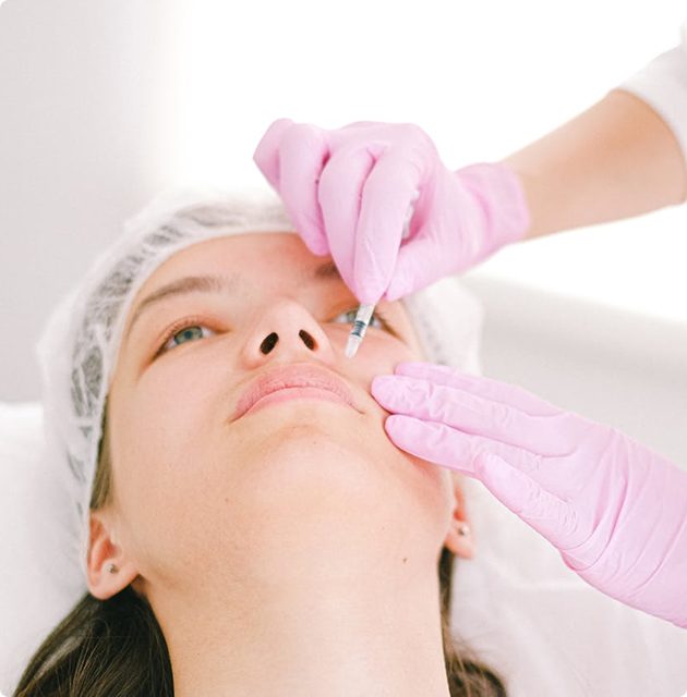 Person receiving cosmetic injection treatment