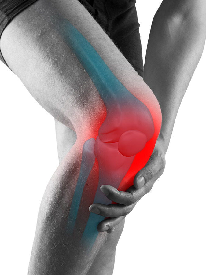 Person holding a knee highlighted in red, with blue shading along the leg to illustrate pain or injury