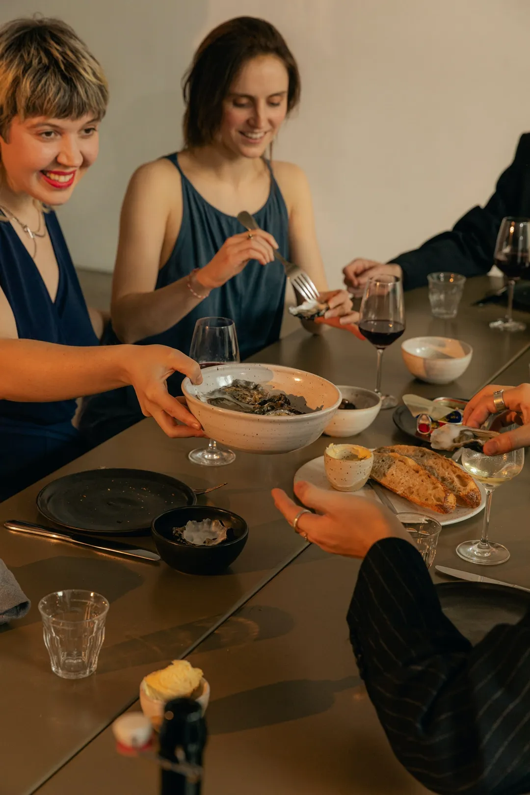 Four women sharing a low-calorie meal at a restaurant